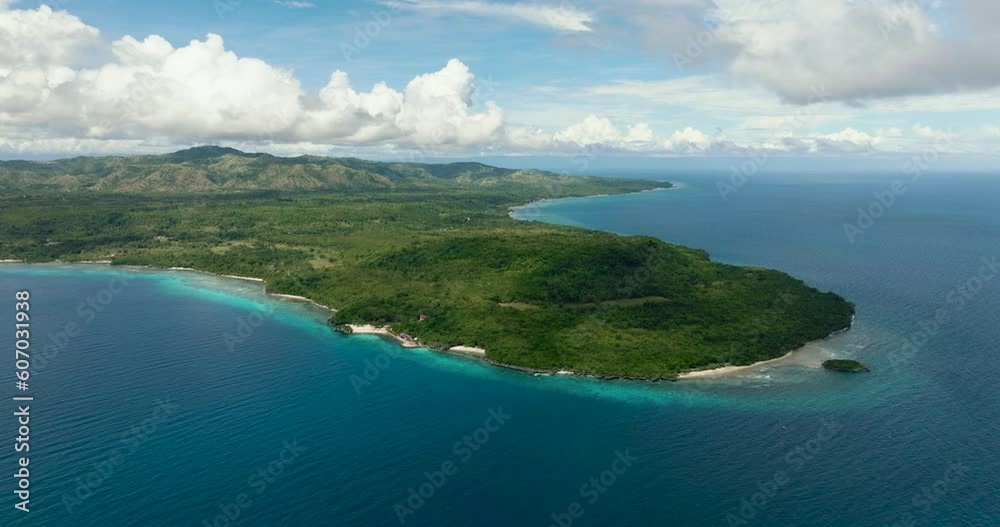Coast with a shiny white beach under clear blue sky. Fly above a paradise Island. Siquijor, Philippines. Coast with a shiny white beach under clear blue sky. Fly above a paradise Island. Siquijor, Philippines.