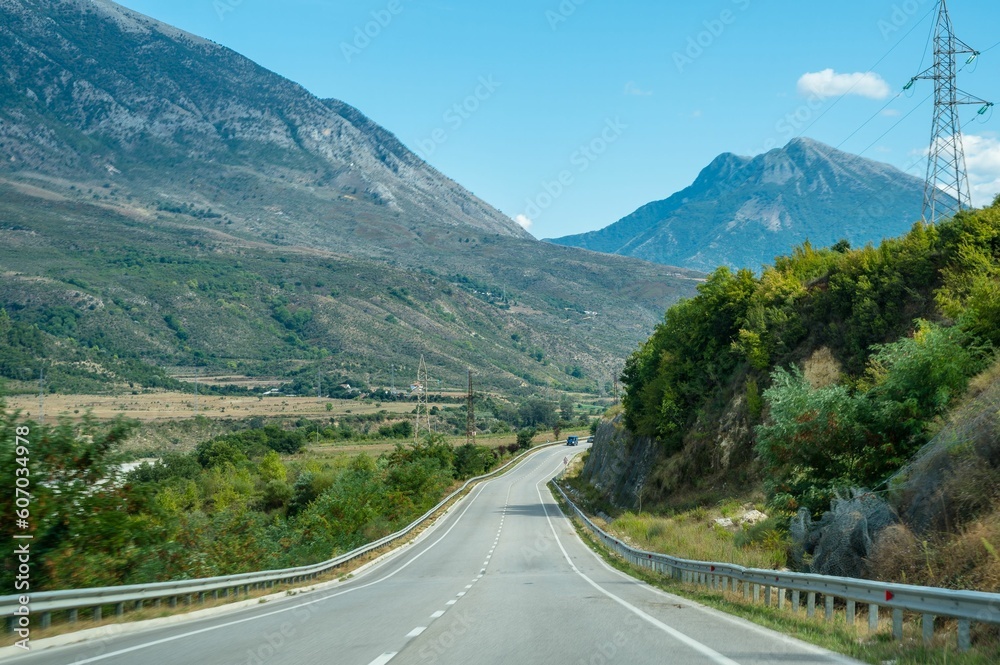 Naklejka premium Straight highway with mountains in albania