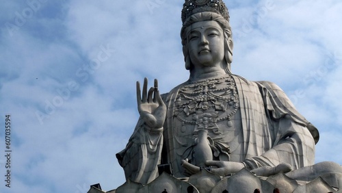 Giant statue with a blue sky background