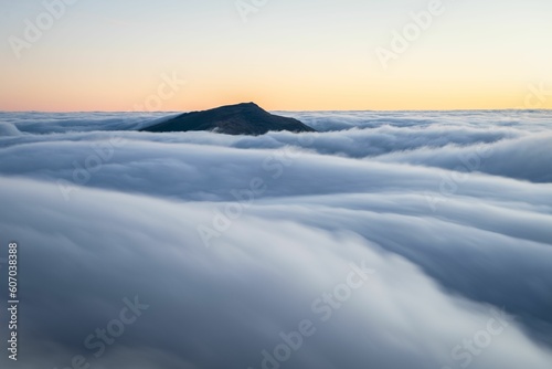 Beautiful landscape of cloud inversion with Moel Siabod summit appearing above