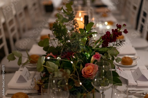 Closeup shot of an arranged wedding reception table with flowers