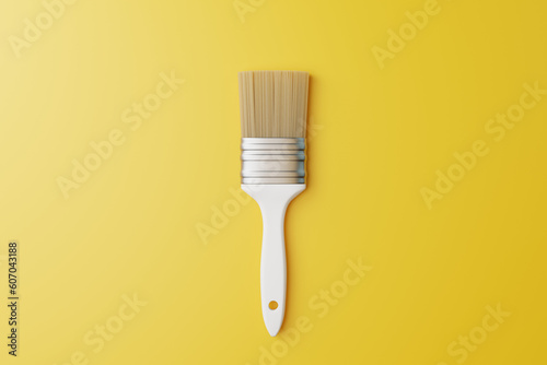 Paint brush on a yellow background. View from above. Repair concept. 3d render illustration