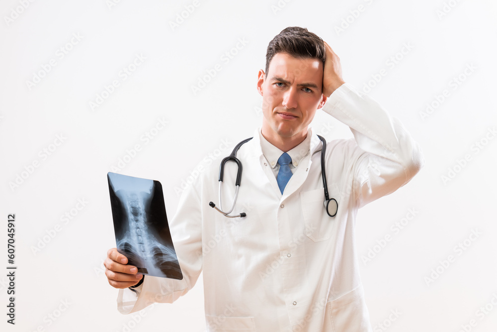 Image of worried doctor looking at x-ray image . Image of worried doctor looking at x-ray image .