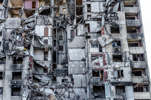 Destroyed residential building after russian missle rocket attack during war in Ukraine closeup. Abandoned house ruins in city Kharkiv © tan4ikk