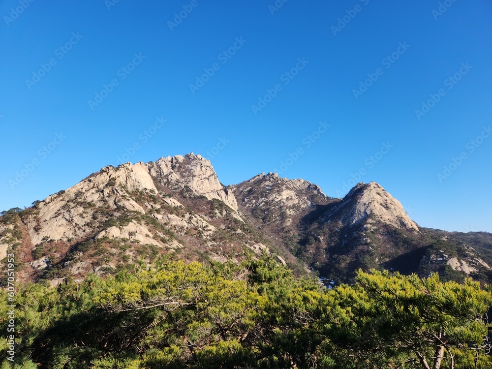 magnificent mountain landscape. Hiking and mountaineering. Mountain paths and stone steps. peak. Seasons in the mountains: autumn - winter - spring - summer. Hiking in the mountains