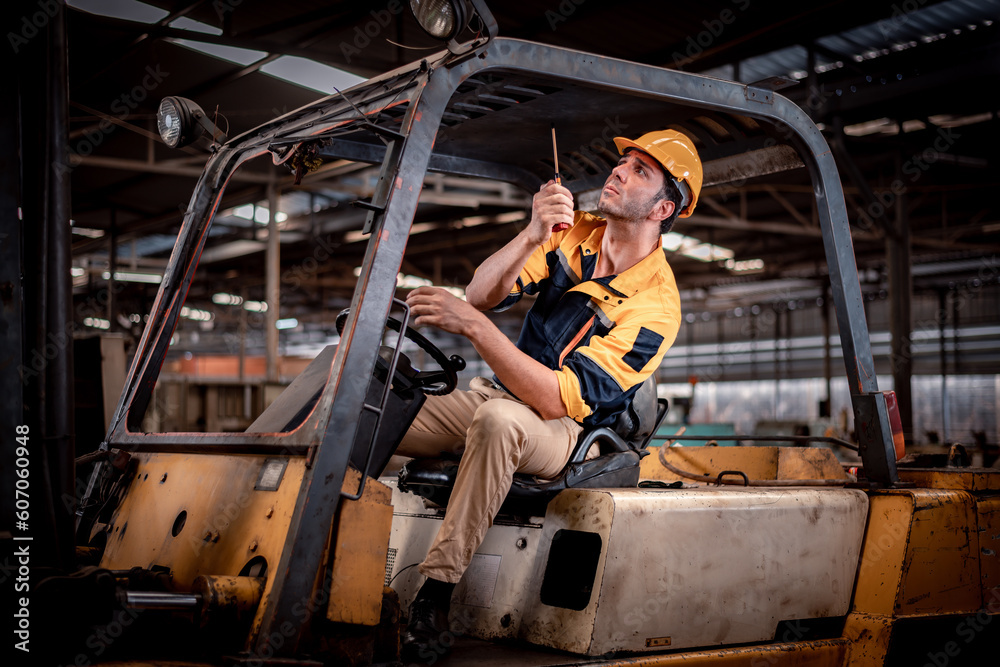 Worker industry factory wear safety uniform factory drive forklift truck moving goods to industry production shelves in factory warehouse area is industry transportation business concept.