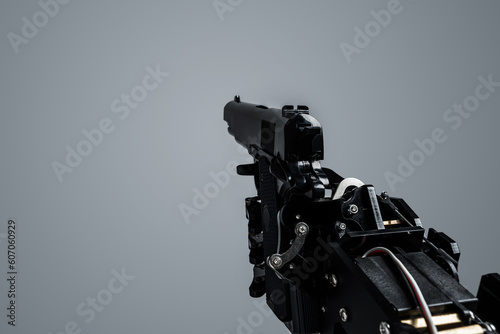 Fotografie First person view of real robot's hand with handgun