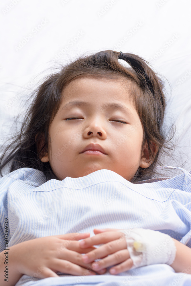Little Asian Thai Girl, Recovering Sleep on white patient Bed Background. Little Asian Thai Girl, Recovering Sleep on white patient Bed Background.