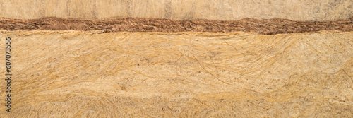 abstract landscape - background of buckskin amate bark paper handmade created in Mexico, panorama banner