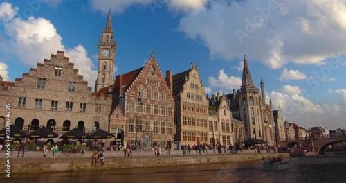Wide shot of the city of Gent. Famous the cities landscape and historic landmarks. Establishing shot of old houses, streets and river in the city of Ghent on a sunny day, Belgium