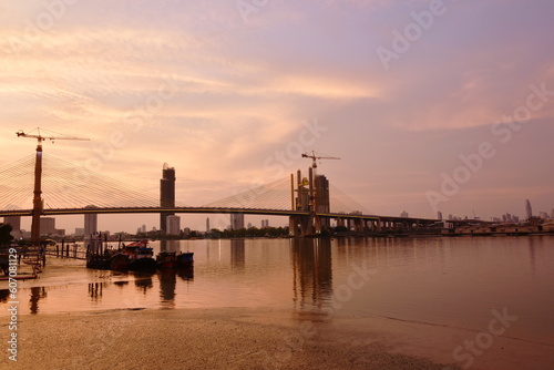 new Rama nine suspension bridge under construction cross Chao Phraya  river in Thailand on sunset