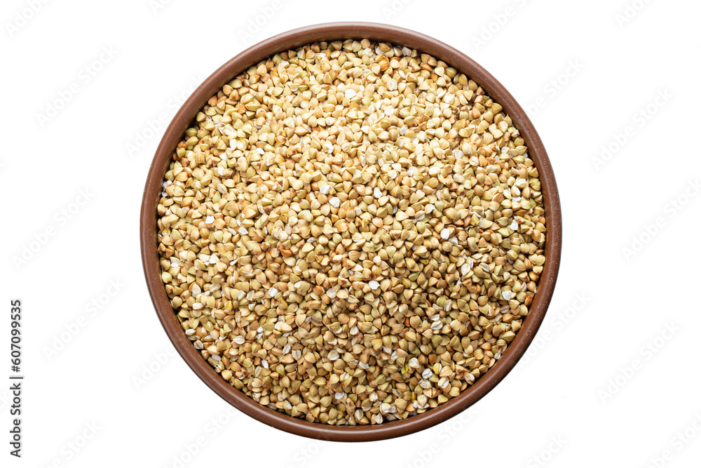 Unroasted buckwheat in a bowl. Isolated on a white background. Unroasted buckwheat in a bowl. Isolated on a white background.