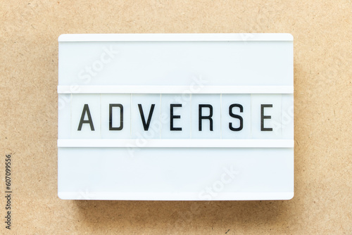 Принти на полотні Lightbox with word adverse on wood background