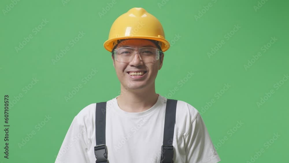 Close Up Of Asian Man Worker Wearing Goggles And Safety Helmet Standing And Smiling To Camera In The Green Screen Background Studio
Close Up Of Asian Man Worker Wearing Goggles And Safety Helmet Standing And Smiling To Camera In The Green Screen Background Studio