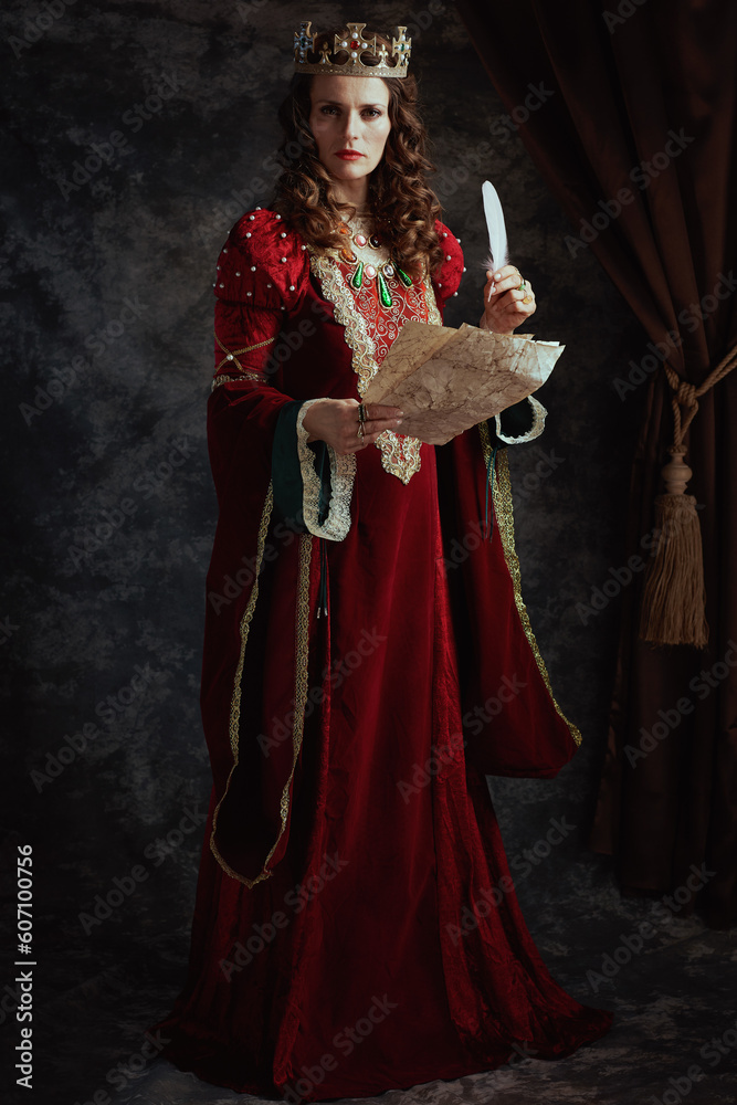 Full length portrait of medieval queen in red dress Full length portrait of medieval queen in red dress