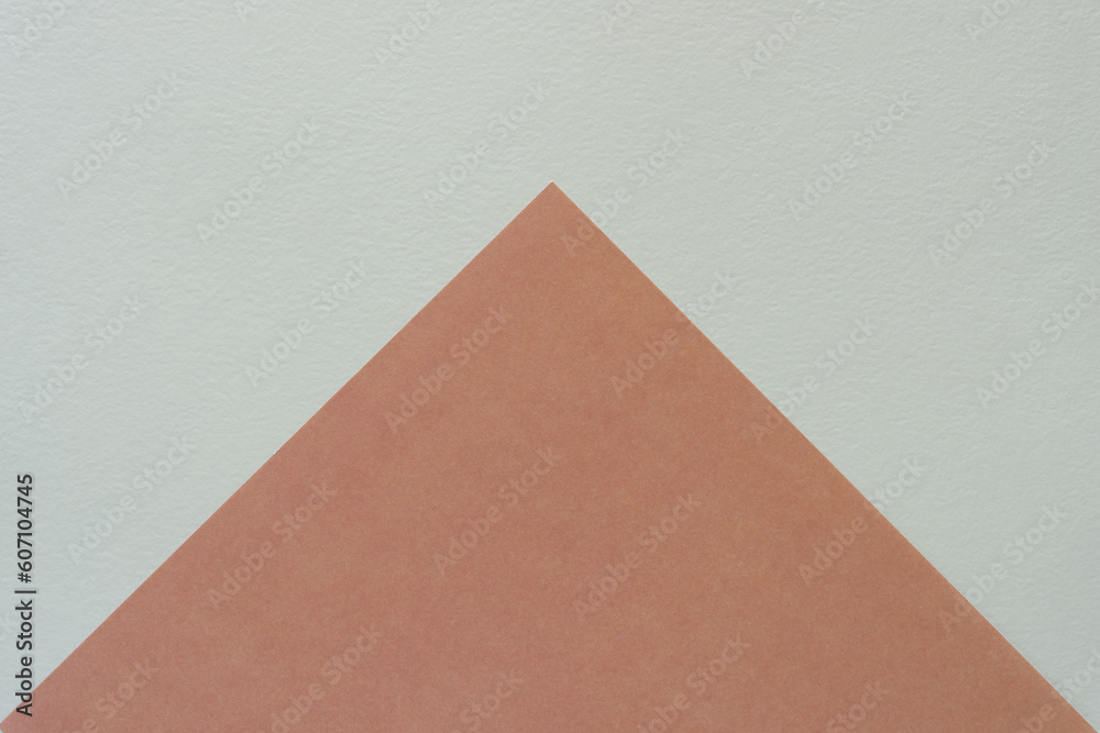 paper triangle (or pyramid) shape on textured paper background paper triangle (or pyramid) shape on textured paper background