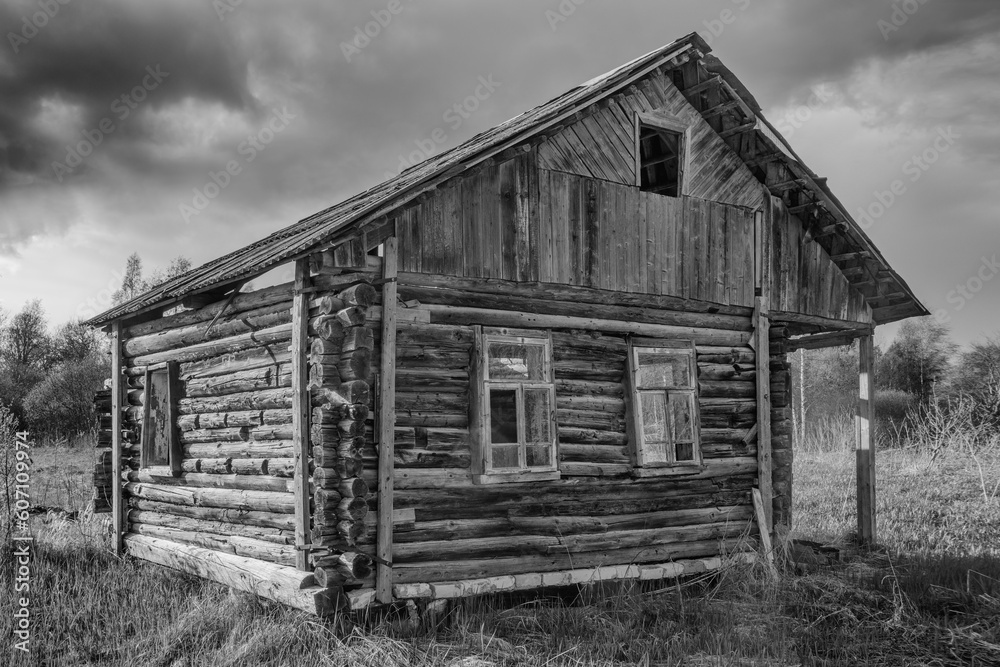 Old destroyed wooden house. Black and white photo Old destroyed wooden house. Black and white photo