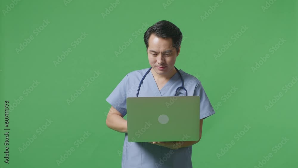 Asian Male Doctor With Stethoscope Holding A Laptop And Smiling On Green Screen Background In The Hospital
Asian Male Doctor With Stethoscope Holding A Laptop And Smiling On Green Screen Background In The Hospital