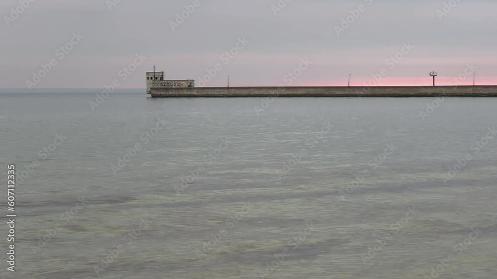 View of the sea and the harbor on a cloudy day. View of the sea and the harbor on a cloudy day.