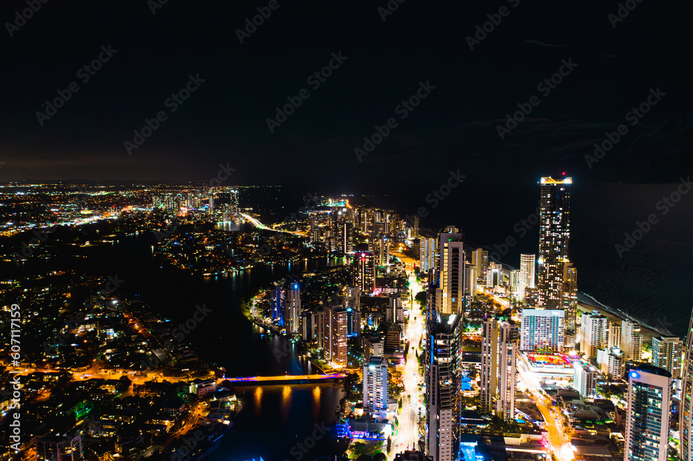 Luminescent Splendor: A Mesmerizing Aerial View of Surfers Paradise's Nighttime Downtown Skyline Illuminated in Vibrant Glow