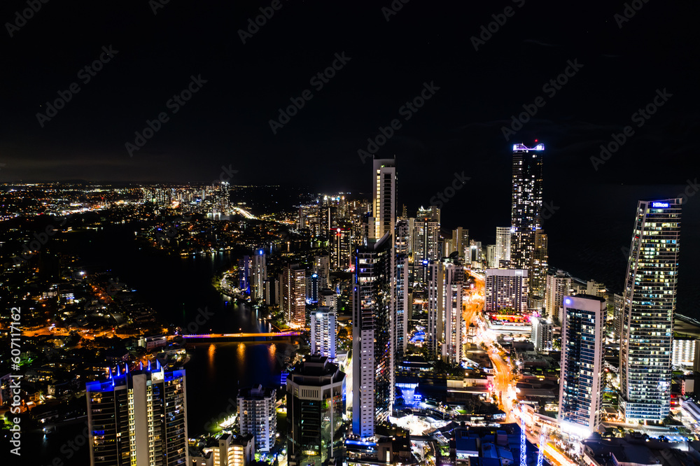 Obraz premium Glowing Splendor: Mesmerizing Aerial View of Surfers Paradise's Luminescent Downtown Buildings