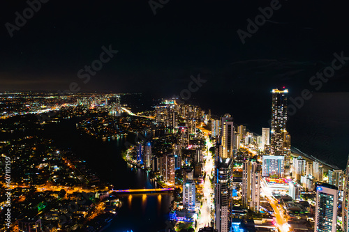 Luminescent Splendor: A Mesmerizing Aerial View of Surfers Paradise's Nighttime Downtown Skyline Illuminated in Vibrant Glow