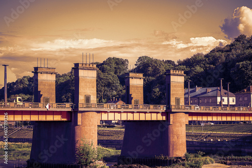 Bridge over river over the Nemunas river in Kaunas, Lithuania in sepia tones