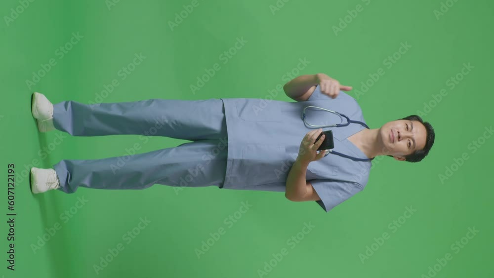 Full Body Of Asian Male Doctor With Stethoscope Using Smartphone And Showing Thumbs Up Gesture On Green Screen Background In The Hospital
Full Body Of Asian Male Doctor With Stethoscope Using Smartphone And Showing Thumbs Up Gesture On Green Screen Background In The Hospital