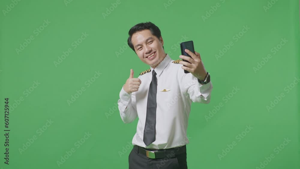 Asian Man Pilot Using Smartphone Taking Picture While Standing In The Green Screen Background Studio
Asian Man Pilot Using Smartphone Taking Picture While Standing In The Green Screen Background Studio