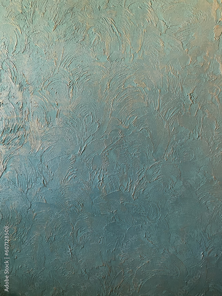 Textured plaster, turquoise with gold, used as a background, side view, texture Textured plaster, turquoise with gold, used as a background, side view, texture