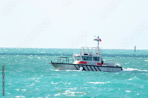 A pilot boat heading out of the channel to guide a cruise ship in Key West. 