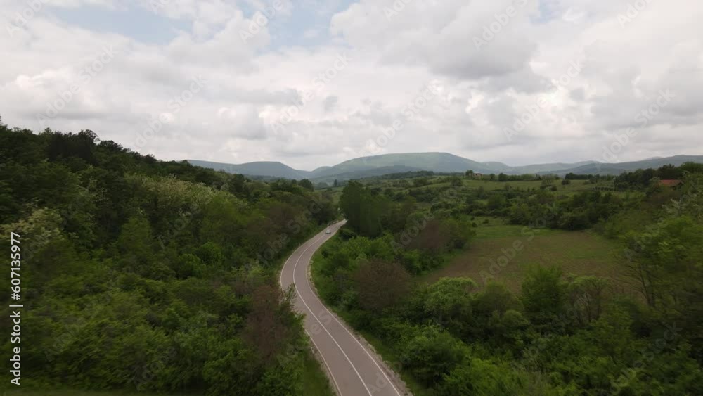 Aerial drone View of Cars Driving on Sunny Spring Day on the road Aerial drone View of Cars Driving on Sunny Spring Day on the road