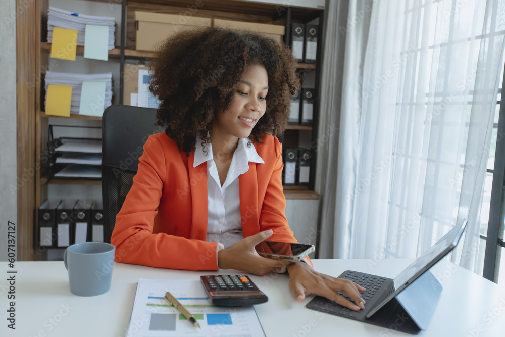 Obraz premium Happy Young African American businesswoman working at desk in office workers, business people with project planning document, Profession businesswomen, accounting and finance.