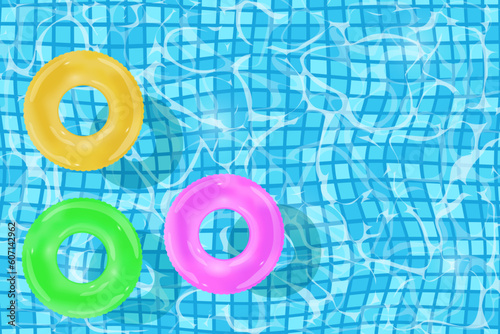 Blue water in the pool with the bottom of tiles. and inflatable rings.  Top view. Vector design	.
