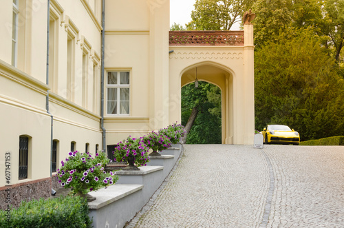 Exquisite Country House with Columns: Front Facade and Parked Yellow Porsche