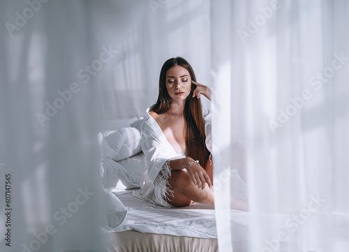Fotografie young beautiful brunette boudoir shooting model plus