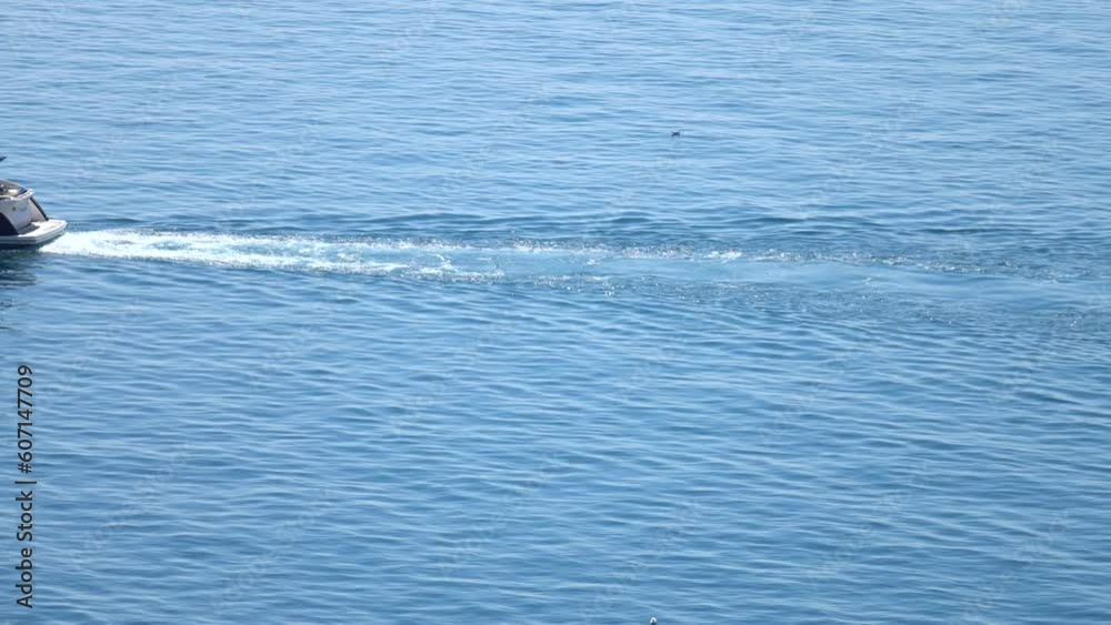 Trace on the surface of the water behind a yacht sailing on the sea, background Trace on the surface of the water behind a yacht sailing on the sea, background