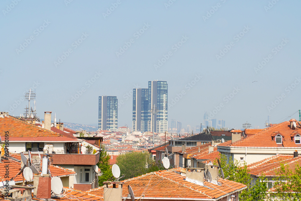 Istanbul, Bakirkoy district, Turkey - June 9, 2023: view of red roofs of old houses and new high buildings. selective focus