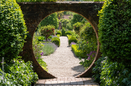 Flower borders in a landscaped garden in Hartley Wintney  Hampshire  UK