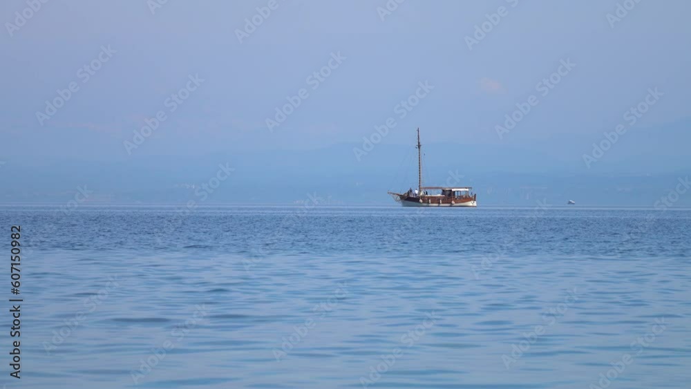 Large yacht floating slowly across the sea on a summer sunny day, background Large yacht floating slowly across the sea on a summer sunny day, background