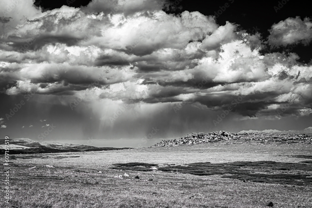 Classic monochrome cloudscape of storm over the Beartooth Mountain Range in Wyoming.