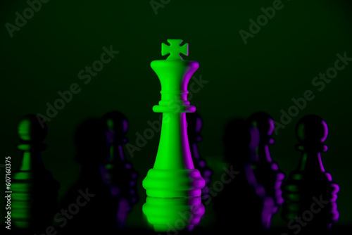 The white king is surrounded by black pawns. Management concept. The concept of bullying. Neon lights in the dark