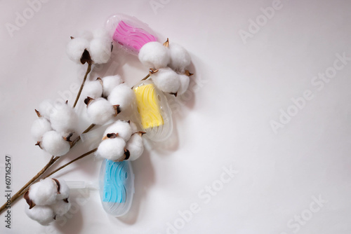 Beautiful white cotton flower capsules with cleaning air Freshener and toilet detergent on a white background