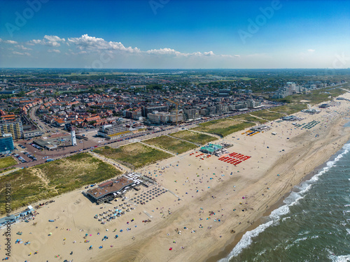 This aerial drone photo shows the boulevard and coastline of Noordwijk aan Zee in Zuid-Holland, the Netherlands. Noordwijk is a coastal town where many tourists come to enjoy their summer holiday.  photo