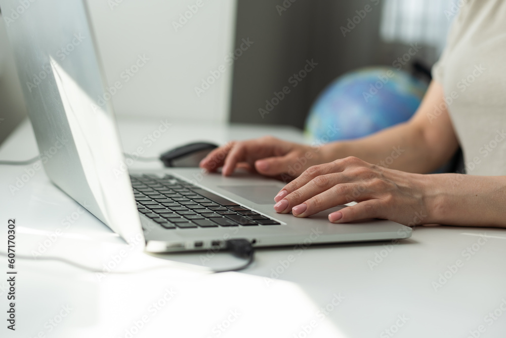 Successful female grapic designer watching tutorial about creative ideas at laptop computer during working process in office.Positive student with blonde hair reading business news on netbook Successful female grapic designer watching tutorial about creative ideas at laptop computer during working process in office.Positive student with blonde hair reading business news on netbook