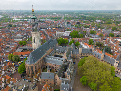 This aerial drone photo shows the city center of Middelburg which is the capital of Zeeland, the Netherlands. There is a beautiful abbey with a giant tower in the center. 