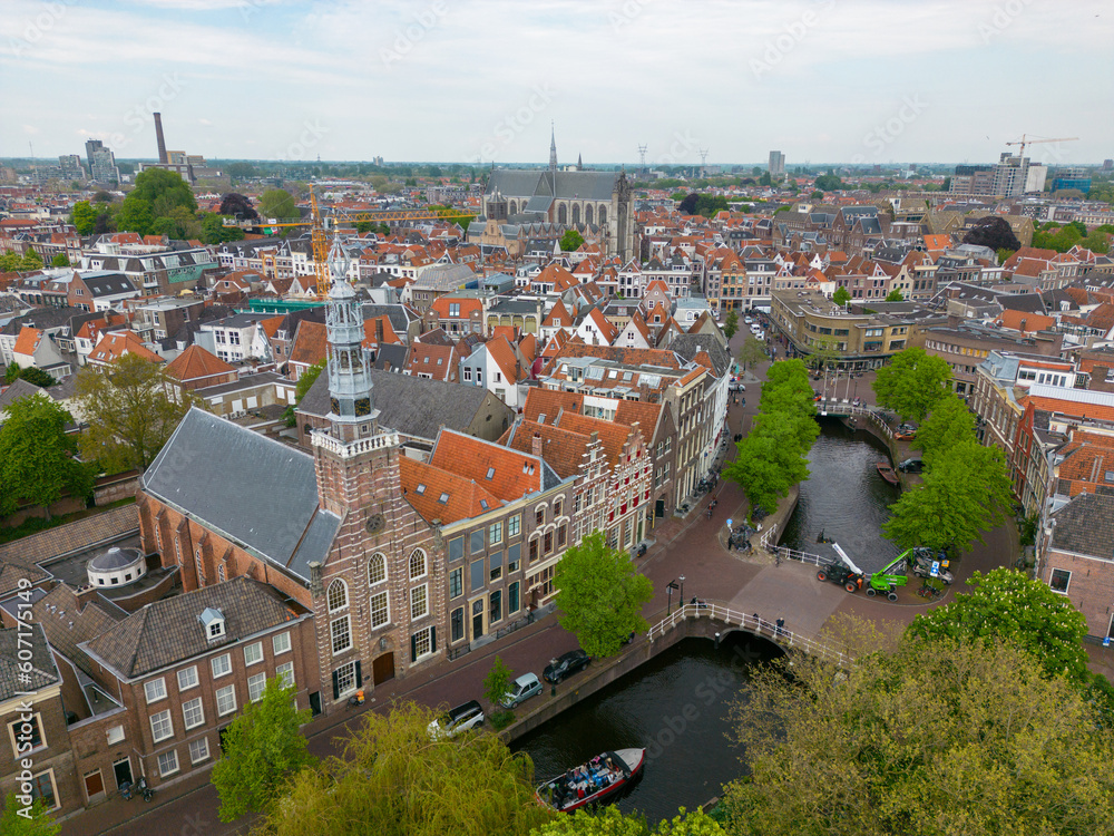 This aerial drone photo shows the canal houses and the canal in Leiden. Leiden is a beautiful and old city in Zuid-Holland, the Netherlands. 