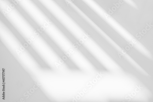 Abstract light reflection and grey shadow from window on white wall background. Gray stripe window shadows and sunshine diagonal line overlay effect for backdrop and mockup design
