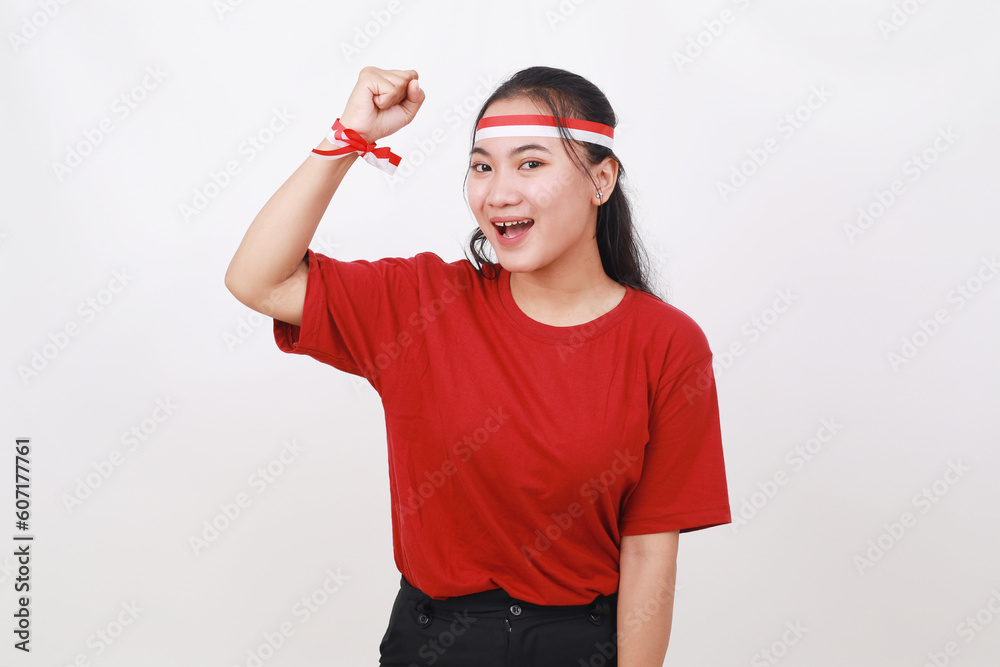 Happy Young Indonesian girl celebrate indonesia independence day with fist hands. Isolated on white Happy Young Indonesian girl celebrate indonesia independence day with fist hands. Isolated on white