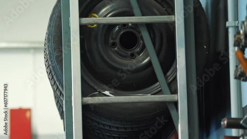 Tire. Car service. In the automotive service, various types of car tires are neatly stacked on top of each other. Perfect for videos about tire selection and automotive services. Tiremounting photo
